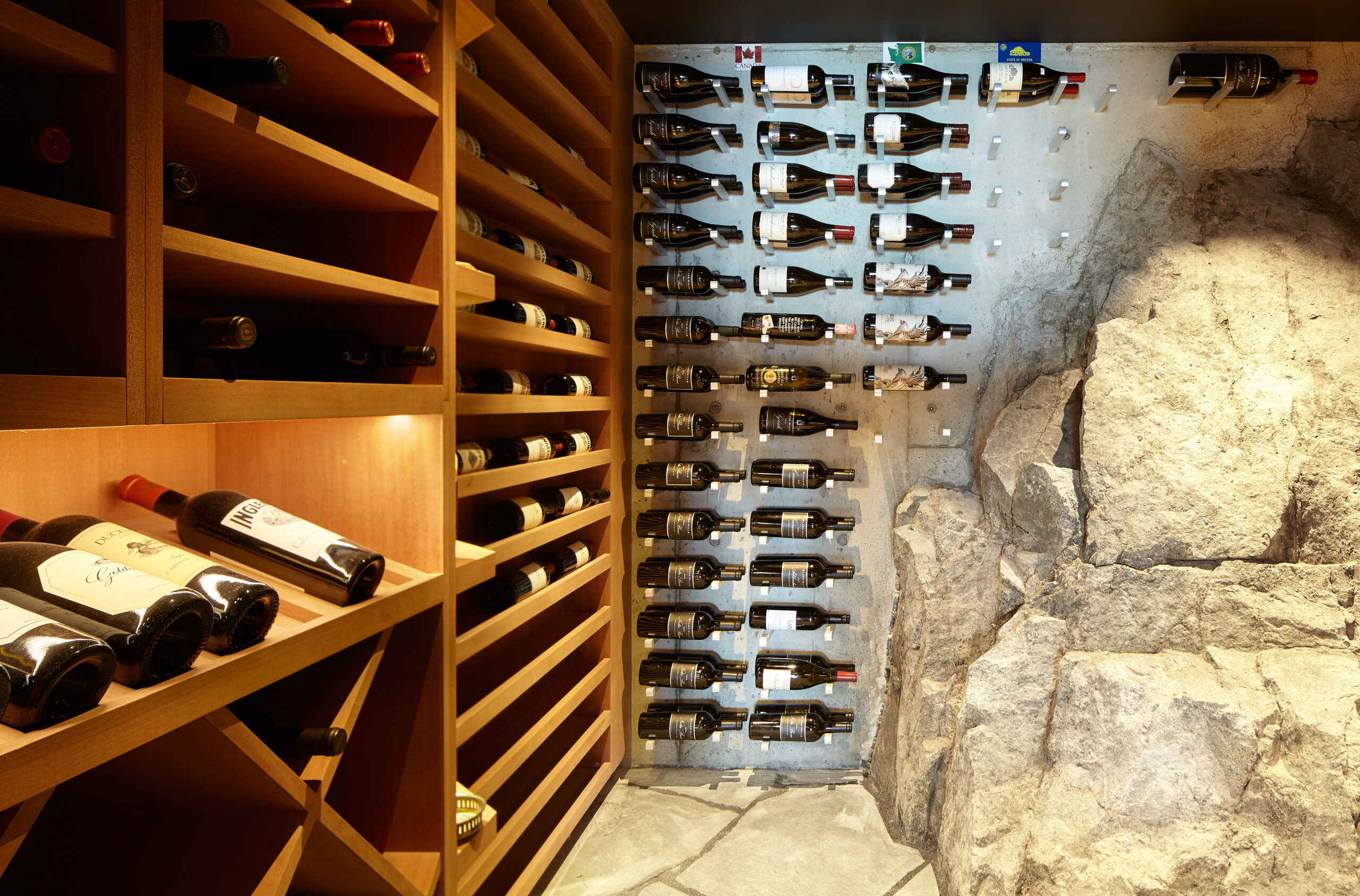 Large rock within a custom wine cellar