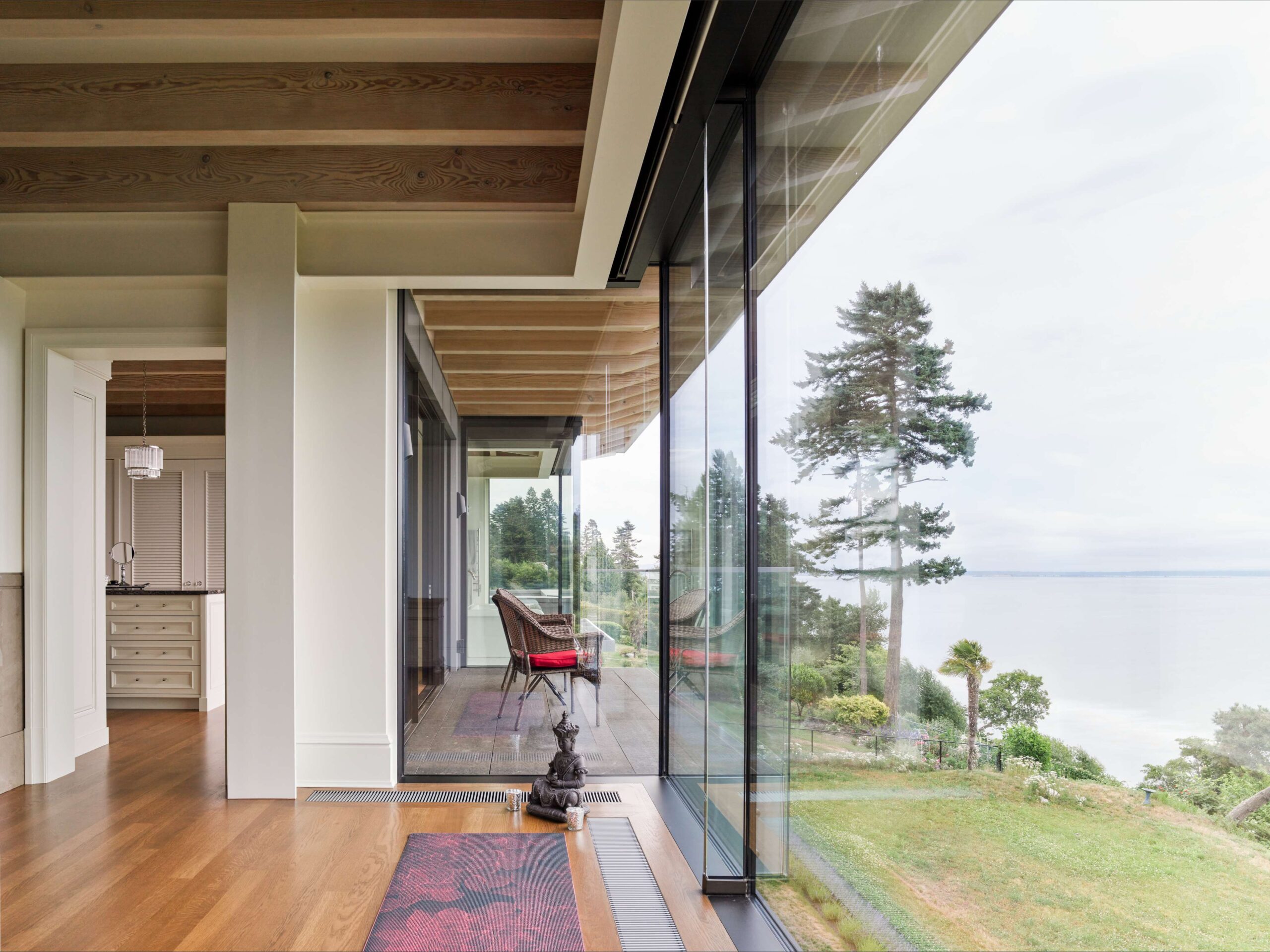 Interior and exterior of a modern home, overlooking the ocean