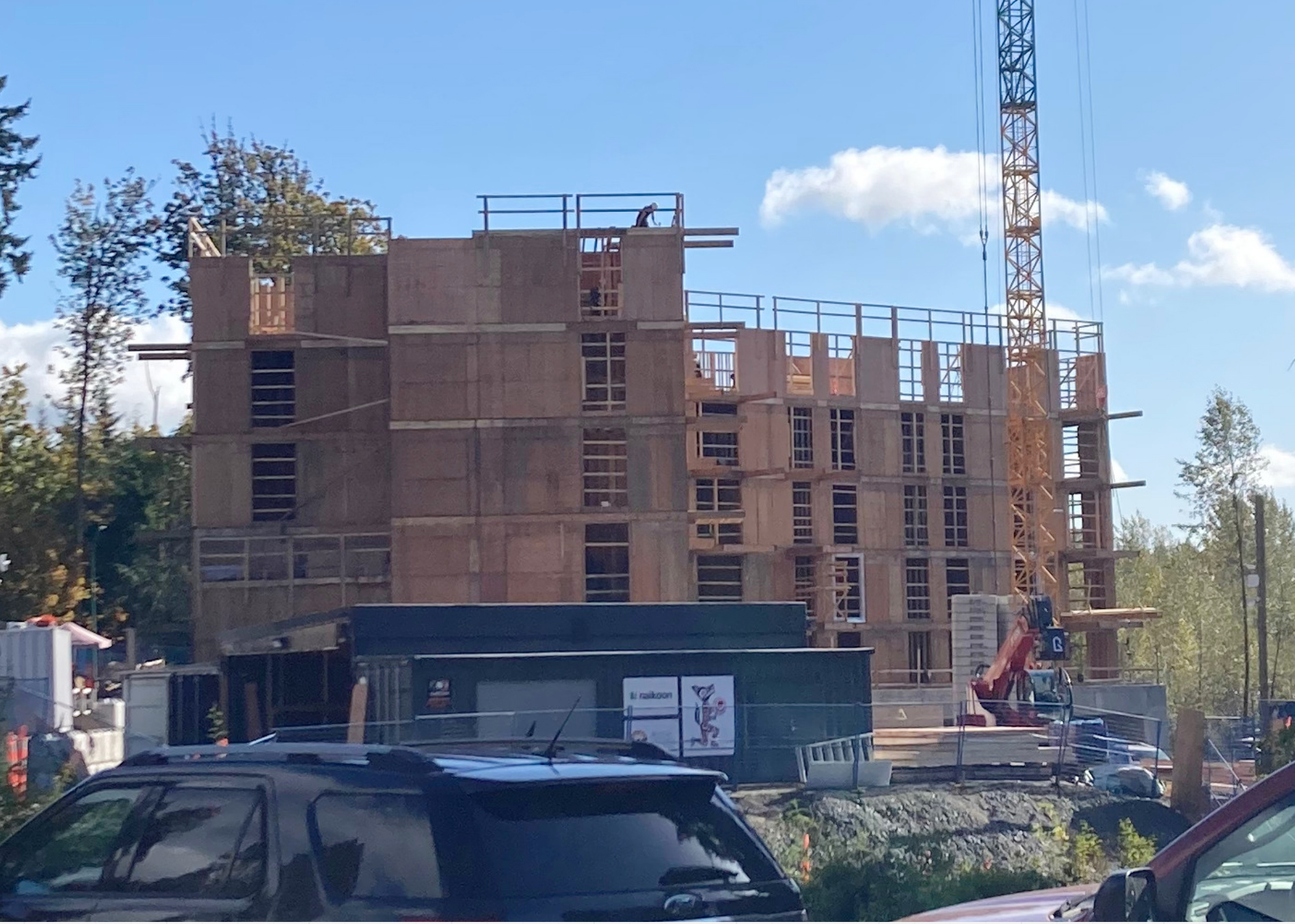 Flying Factory with Hwul’a’mut Housing Society in the background